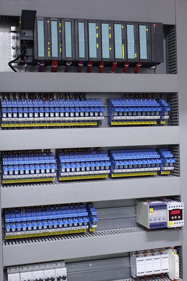 PLC rack and terminal rows inside a control cabinet